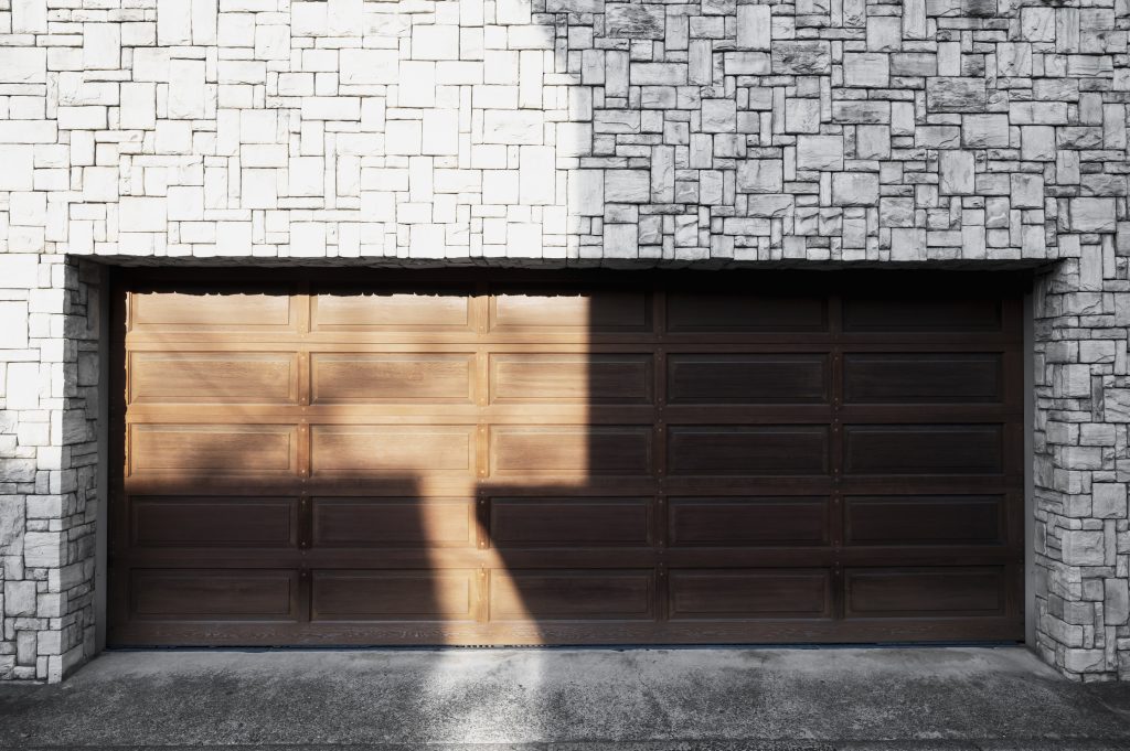 What is the cheapest material for a garage door